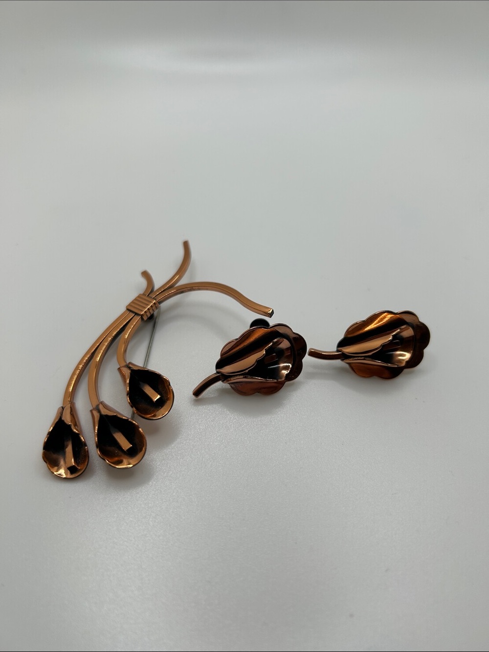 Vintage Renoir calla lily brooch and clip on earrings.